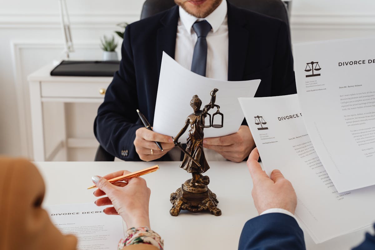 A couple reviewing legal documents with a lawyer for marital dissolution - how to serve divorce papers in California