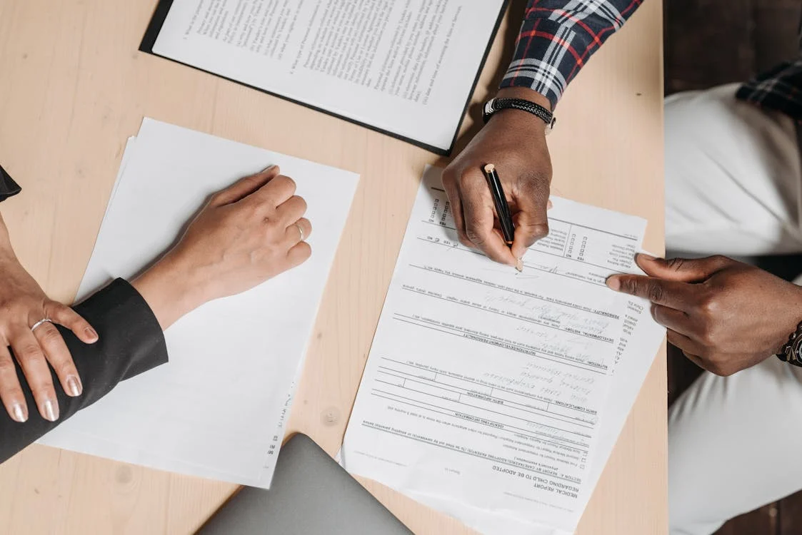a process server completing the delivery of legal papers for a client